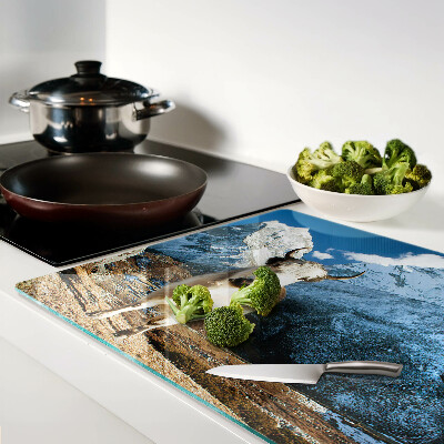 Glass kitchen board A cow in the mountains