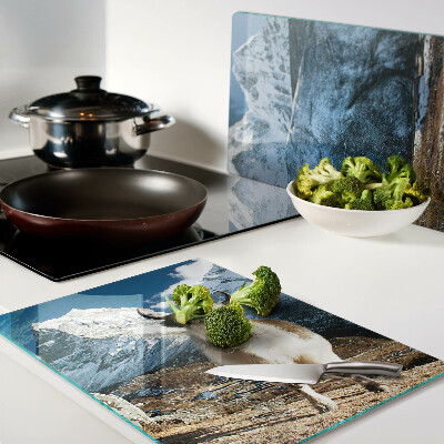Glass kitchen board A cow in the mountains