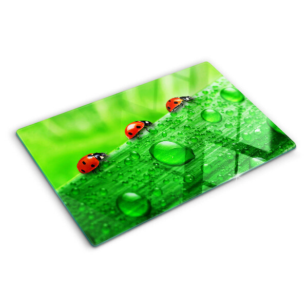 Cutting board Ladybugs on a green background