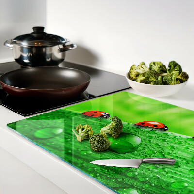 Cutting board Ladybugs on a green background