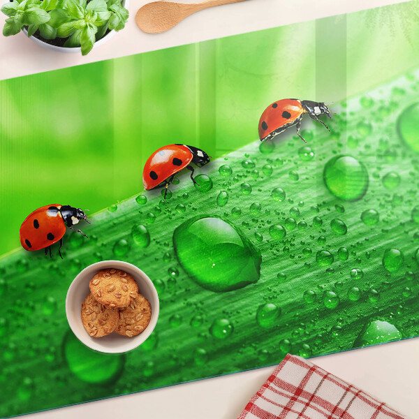 Cutting board Ladybugs on a green background