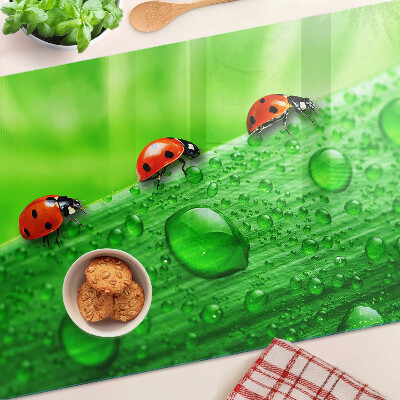 Cutting board Ladybugs on a green background