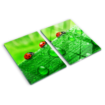 Cutting board Ladybugs on a green background