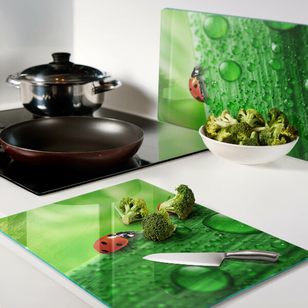 Cutting board Ladybugs on a green background