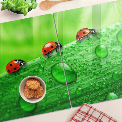 Cutting board Ladybugs on a green background