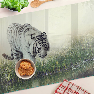 Glass kitchen board Tiger in the grass
