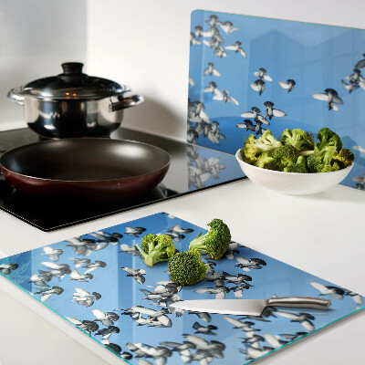 Chopping board Pigeons flying in the sky