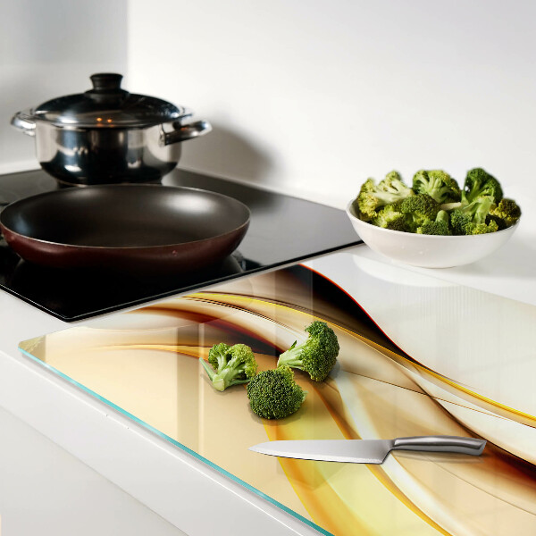 Glass chopping board Abstract waves in shades of gold