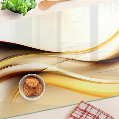 Glass chopping board Abstract waves in shades of gold