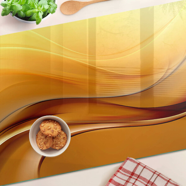 Glass cutting board Waves in shades of gold