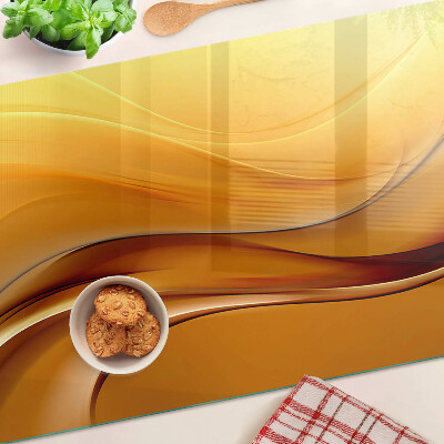 Glass cutting board Waves in shades of gold