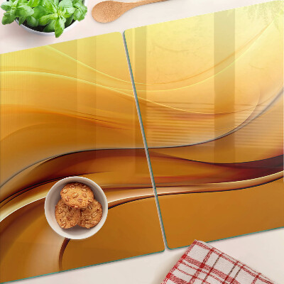 Glass cutting board Waves in shades of gold