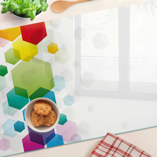 Glass cutting board Colorful hexagons on the background