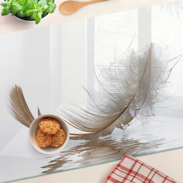 Chopping board A feather against the water