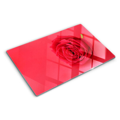 Cutting board Red rose on the background