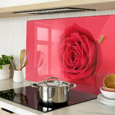 Cutting board Red rose on the background