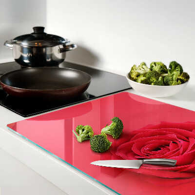 Cutting board Red rose on the background