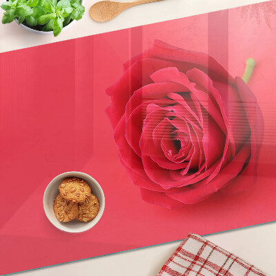 Cutting board Red rose on the background