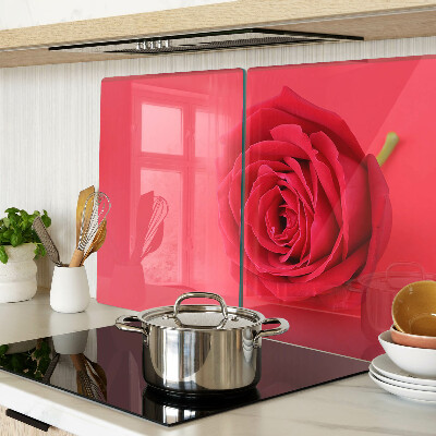Cutting board Red rose on the background