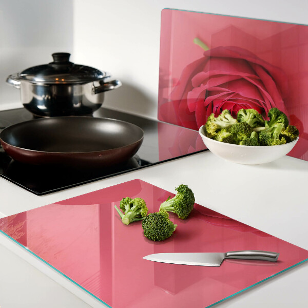 Cutting board Red rose on the background