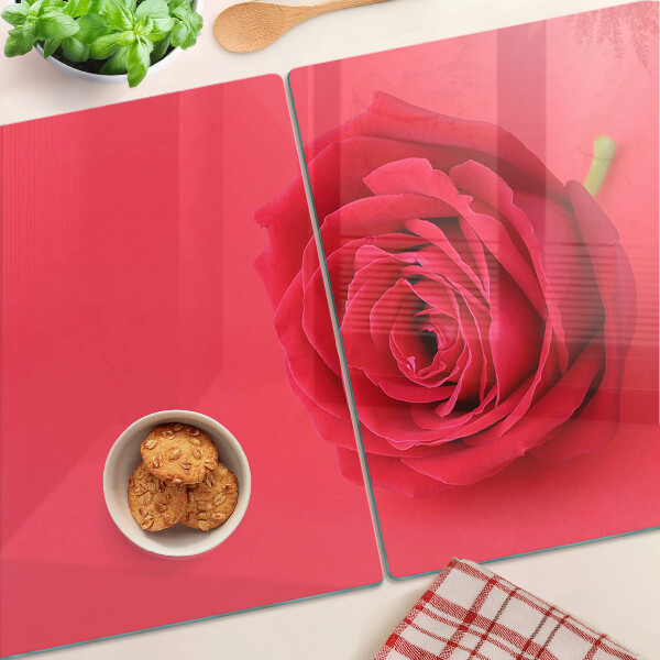 Cutting board Red rose on the background