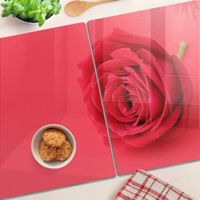 Cutting board Red rose on the background