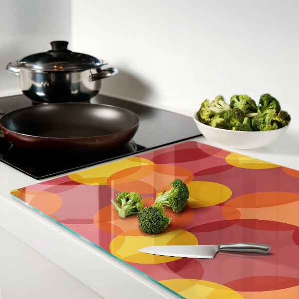 Glass chopping board Colorful circles in warm tones