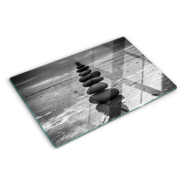 Glass cutting board Beach stones in black and white