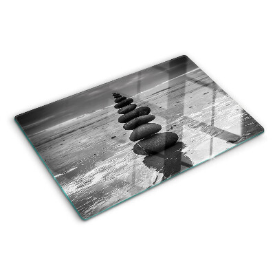 Glass cutting board Beach stones in black and white