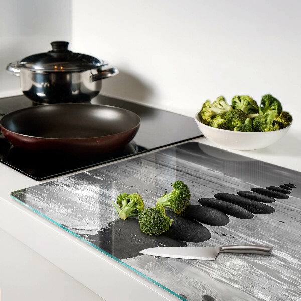 Glass cutting board Beach stones in black and white