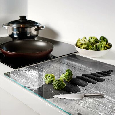 Glass cutting board Beach stones in black and white
