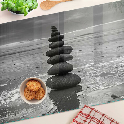 Glass cutting board Beach stones in black and white