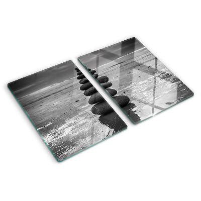 Glass cutting board Beach stones in black and white