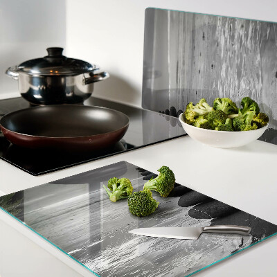 Glass cutting board Beach stones in black and white