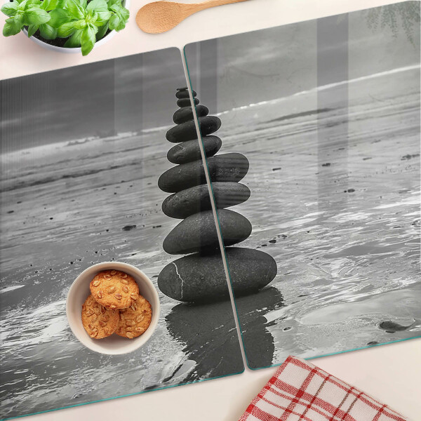 Glass cutting board Beach stones in black and white