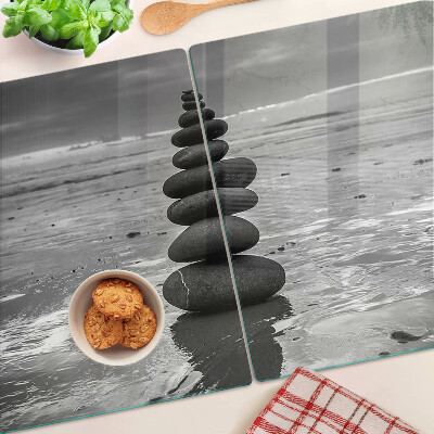 Glass cutting board Beach stones in black and white