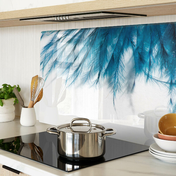 Glass chopping board Blue feathers on a white background