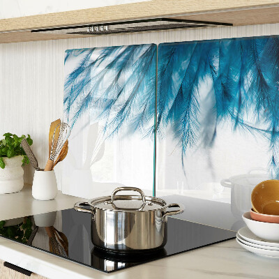 Glass chopping board Blue feathers on a white background