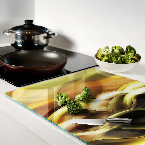 Glass chopping board Abstract waves in shades of gold