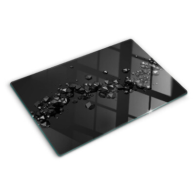 Glass chopping board Black crystals on the background
