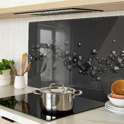 Glass chopping board Black crystals on the background