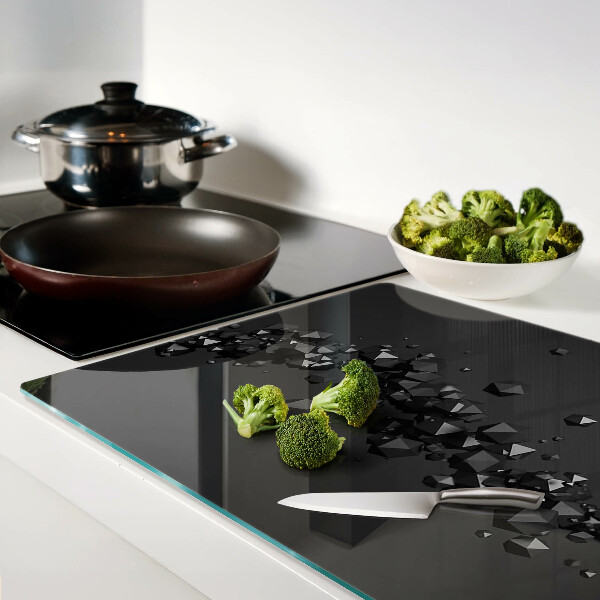 Glass chopping board Black crystals on the background