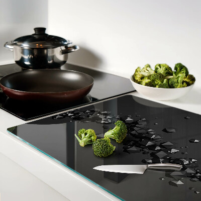 Glass chopping board Black crystals on the background