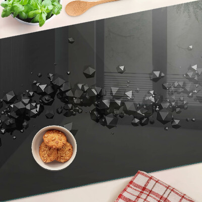 Glass chopping board Black crystals on the background