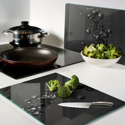 Glass chopping board Black crystals on the background