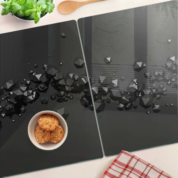 Glass chopping board Black crystals on the background