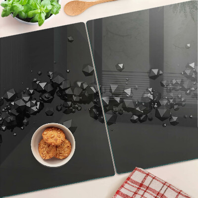 Glass chopping board Black crystals on the background