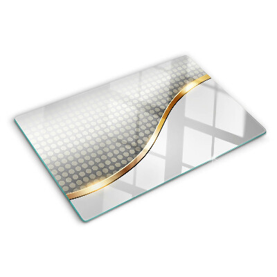 Glass chopping board A golden wave on a background of dots