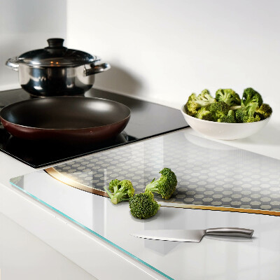 Glass chopping board A golden wave on a background of dots