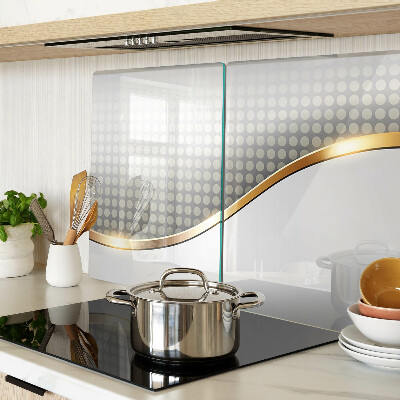 Glass chopping board A golden wave on a background of dots